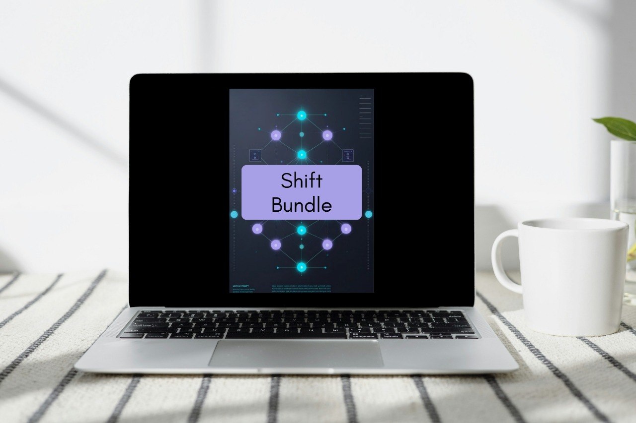 A laptop on a striped tablecloth with a white mug beside it, displaying a digital cover that reads 'Shift Bundle' on a dark background.